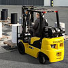 workers play game with fork-lift truck and barrels